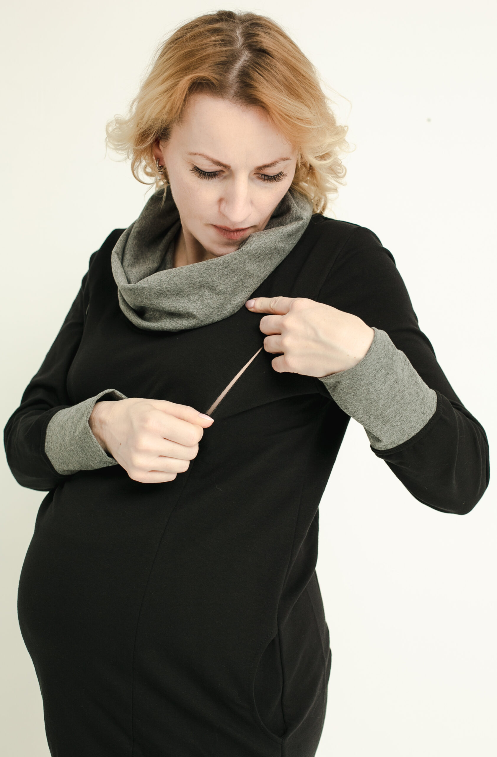 Pregnant woman in breastfeeding dress.