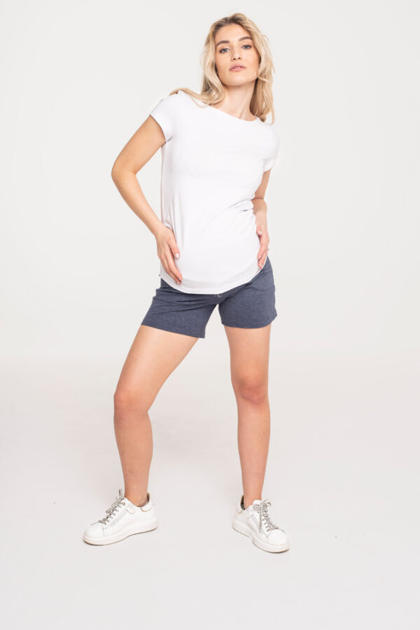 Woman in maternity clothes, blouse, top, shorts.