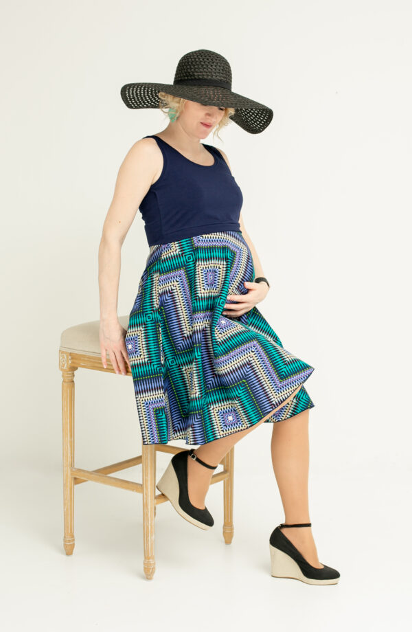 Pregnant woman in maternity and breastfeeding summer dress.