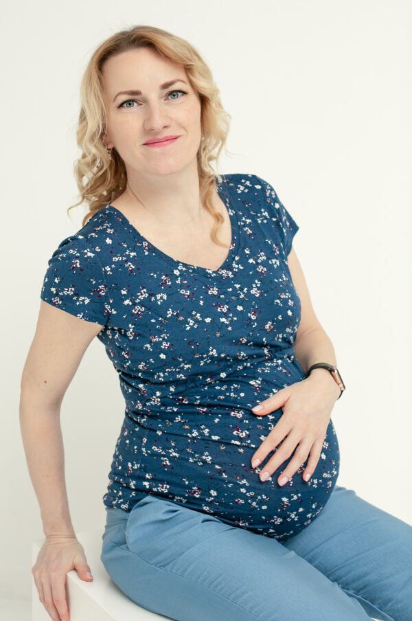 Woman in maternity and breastfeeding blouse.